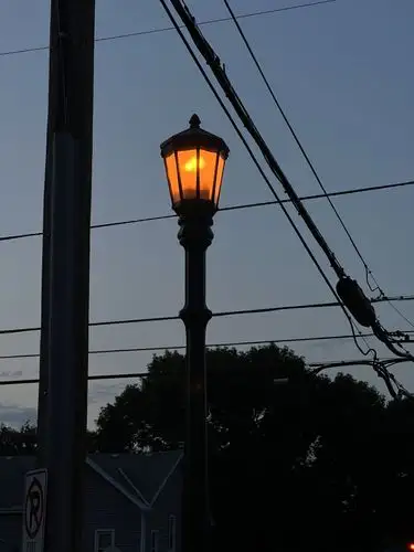 Golden light cuts through the twilight blue.
